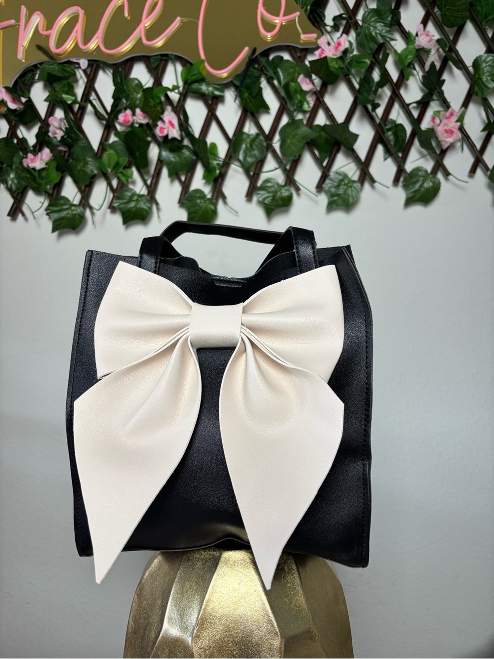 Chic Black Tote with Cream Bow Accent